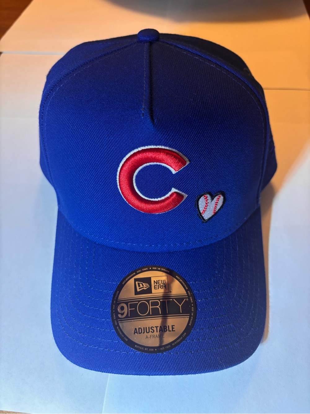 CUBS HAT. New Era Royal Blue Baseball Cap with Red C and White Heart Accent